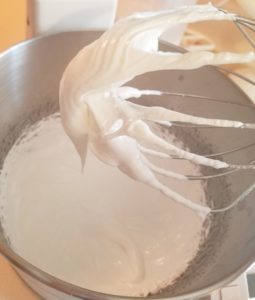 stiffened egg whites in mixing bowl