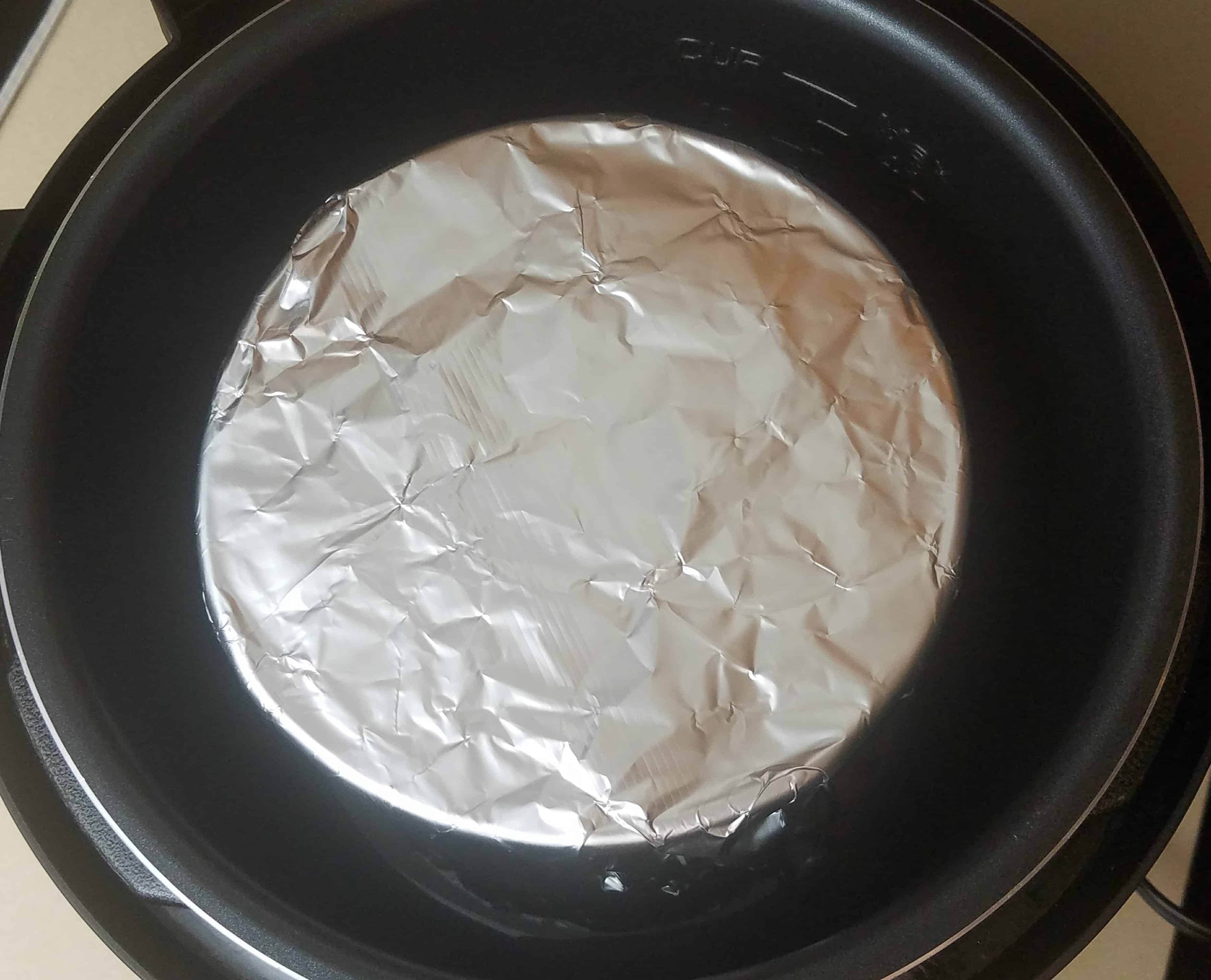 aluminum foil on a spring pan inside instant pot