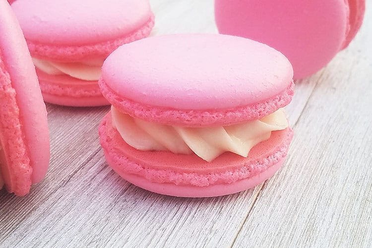 Pink macarons filled with cream cheese frosting