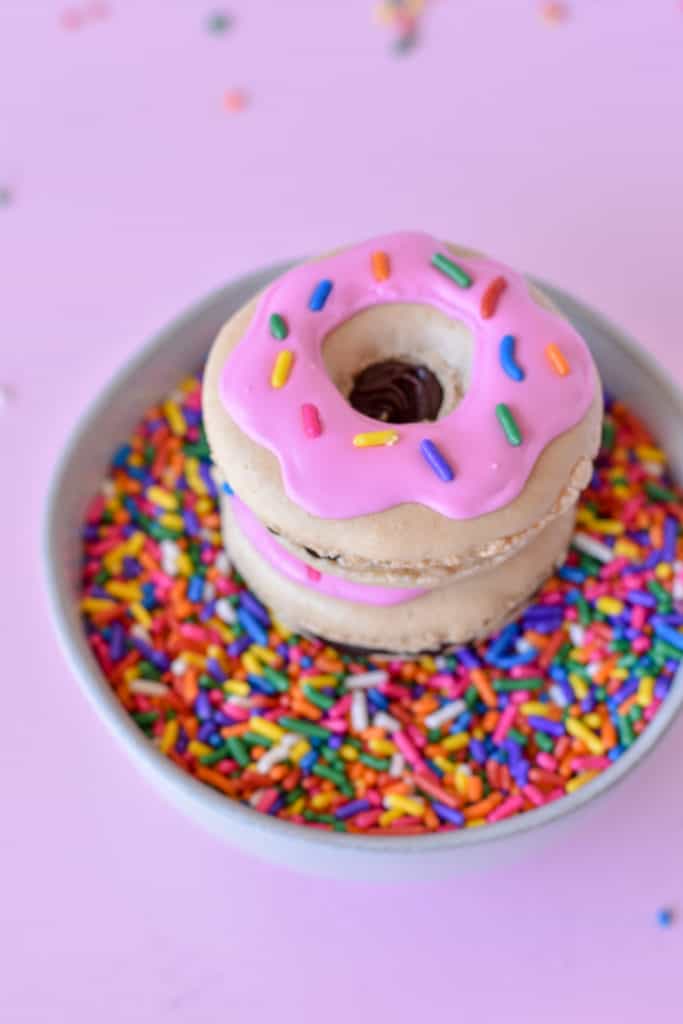 Donut Macaron in a bowl of sprinkles