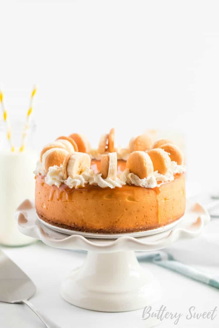 Instant Pot Banana Pudding Cheesecake on a white cake stand