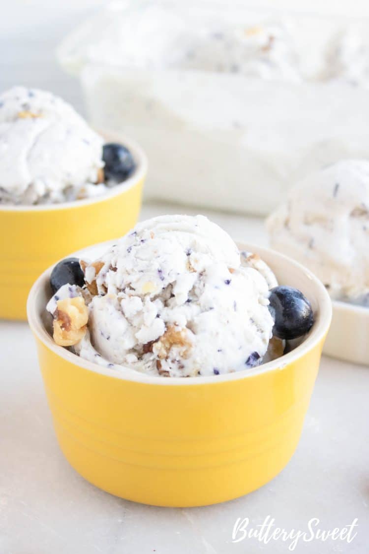 Yellow bowl of No-Churn Blueberry Walnut Ice Cream