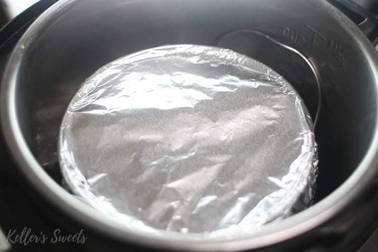 springform pan wrapped in foil in Instant Pot for Funfetti Cheesecake