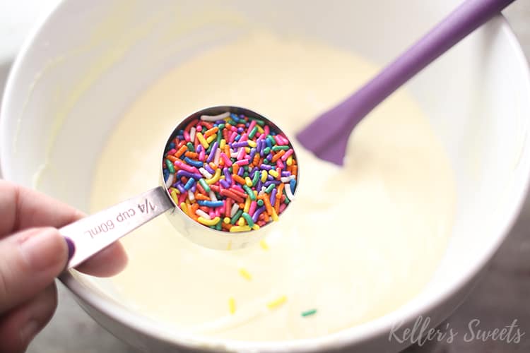 sprinkles in measuring cup for Instant Pot Funfetti Cheesecake batter