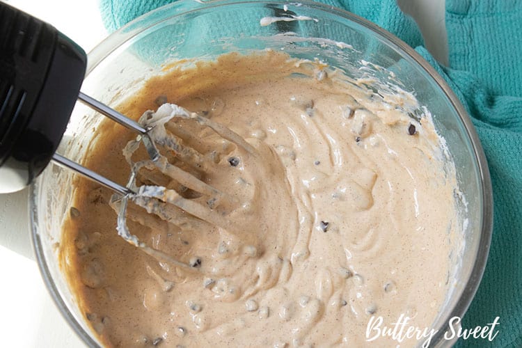 Instant Pot Pumpkin Pecan and Chocolate Chip Cheesecake batter in mixing bowl with mixer