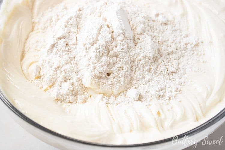 adding flour to batter for Instant Pot Sweet Potato Cheesecake