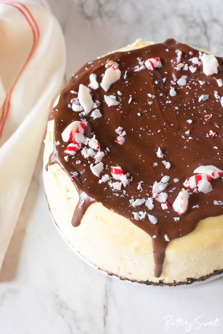 Instant Pot Peppermint Cheesecake with OREO Crust with ganache and peppermint crushed on top
