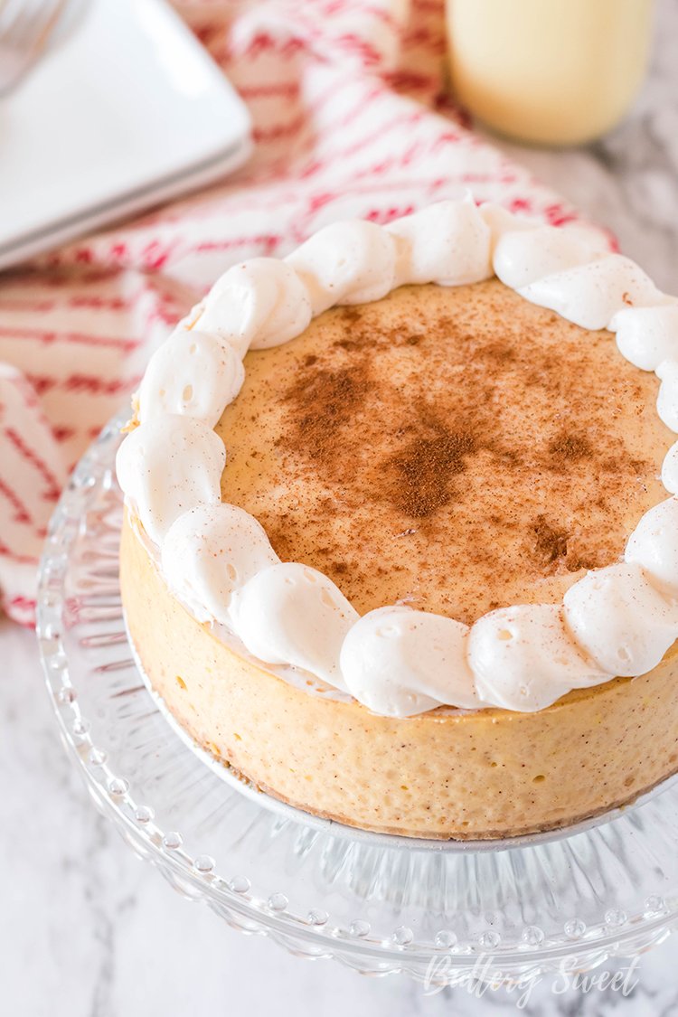 Instant Pot Eggnog Cheesecake dusted with cinnamon and cream cheese frosting