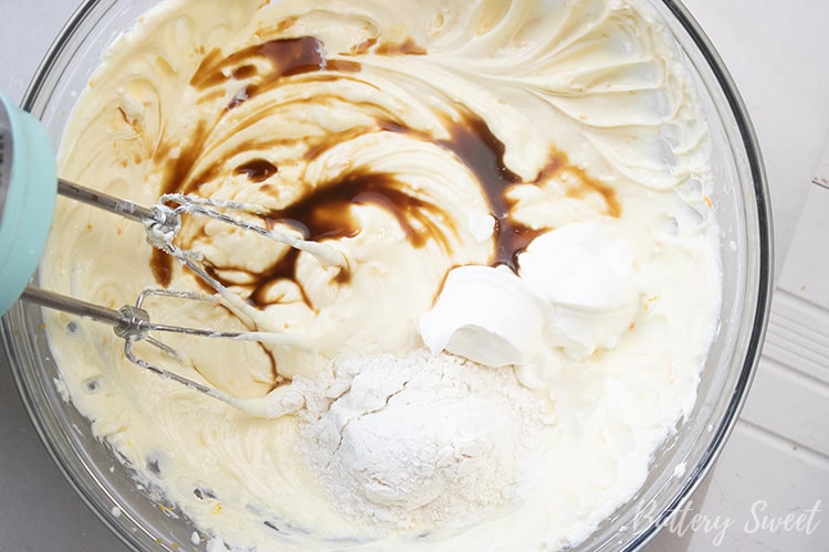Cream cheese mixture with vanilla, flour, and sour cream added on top.