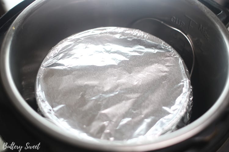 the springform pan wrapped in aluminum foil and placed into the instant pot